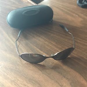 Men’s Oakley sunglasses with clamshell case